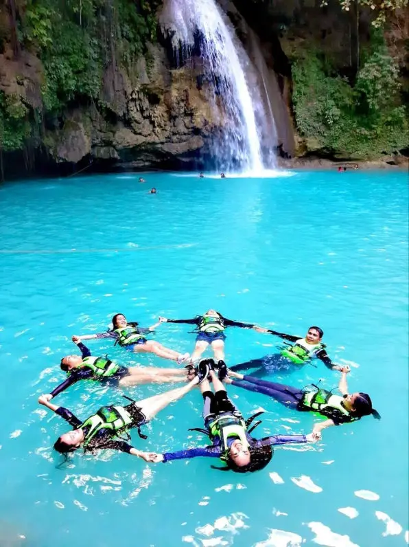 Immerse yourself in the refreshing embrace of Kawasan Falls