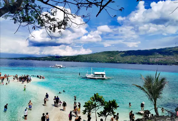 Relax on the pristine beach of Sumilon Island, Cebu