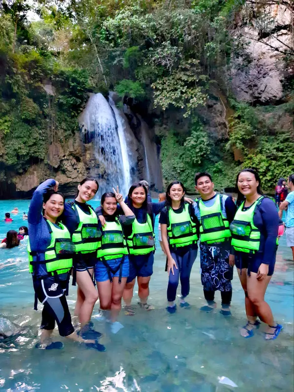 Embark on an optional canyoneering experience in Kawasan Falls.